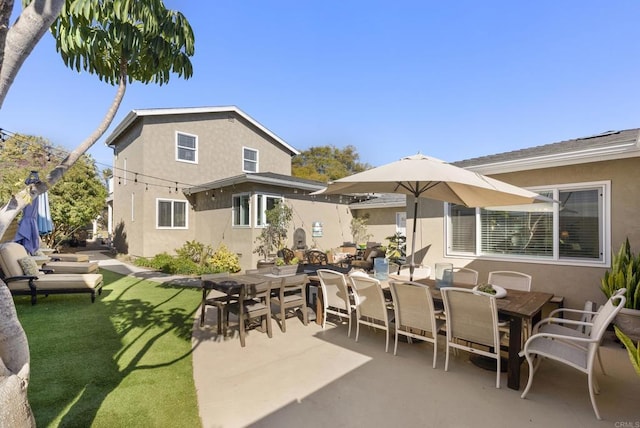 2422 Chatsworth Blvd, Point Loma, CA 92106 - exterior space with a lawn, outdoor dining area, stucco siding, and a patio