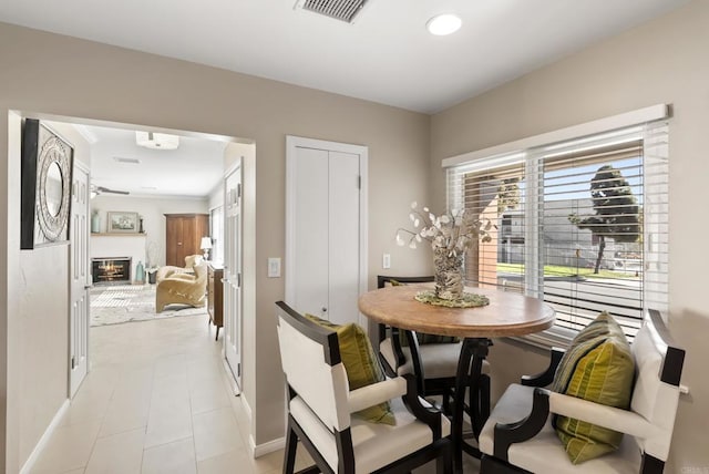 2422 Chatsworth Blvd, Point Loma, CA 92106 - dining area featuring baseboards, visible vents, and a glass covered fireplace