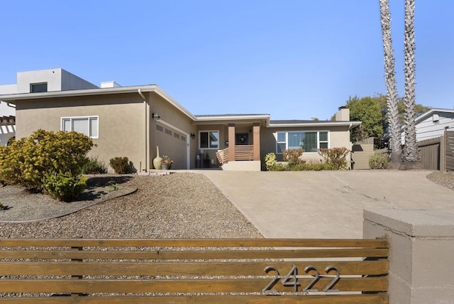 2422 Chatsworth Blvd, Point Loma, CA 92106 - view of front of property with fence, stucco siding, a garage, and concrete driveway