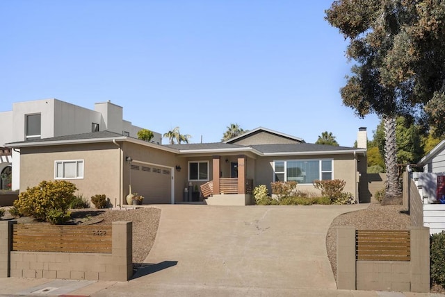 2422 Chatsworth Blvd, Point Loma, CA 92106 - view of front facade featuring stucco siding, concrete driveway, a garage, and roof with shingles