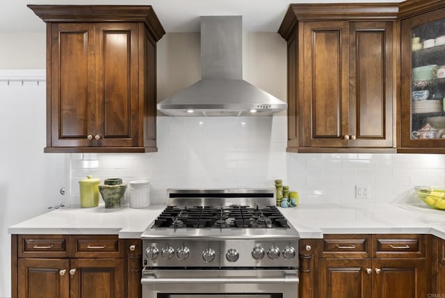 2422 Chatsworth Blvd, Point Loma, CA 92106 - kitchen featuring light countertops, stainless steel gas stove, backsplash, wall chimney range hood, and glass insert cabinets