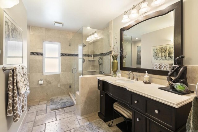 2422 Chatsworth Blvd, Point Loma, CA 92106 - bathroom featuring a stall shower, visible vents, stone tile floors, and vanity