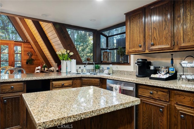 31353 Lightfoot Way, Running Springs, CA 92382 - kitchen featuring light stone countertops, a kitchen island, and wooden walls