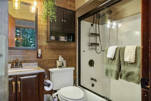 31353 Lightfoot Way, Running Springs, CA 92382 - full bathroom with wood walls, vanity, and combined bath / shower with glass door