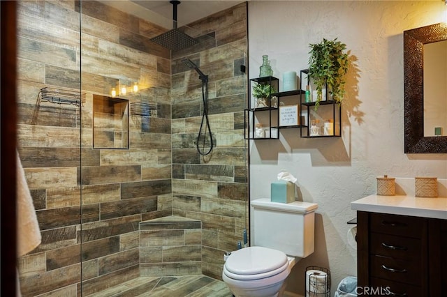 31353 Lightfoot Way, Running Springs, CA 92382 - full bathroom with vanity, a textured wall, and a tile shower