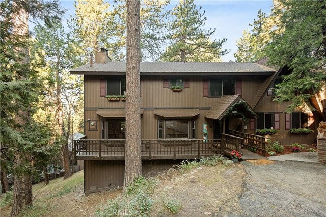 31353 Lightfoot Way, Running Springs, CA 92382 - chalet / cabin with a chimney, roof with shingles, and a wooden deck