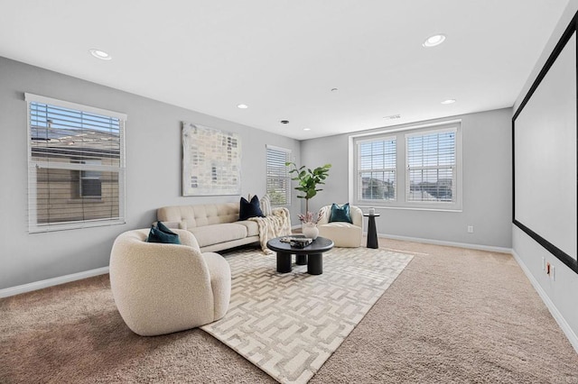 carpeted living room with baseboards, recessed lighting, and plenty of natural light