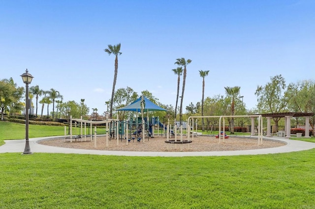 community jungle gym with a lawn