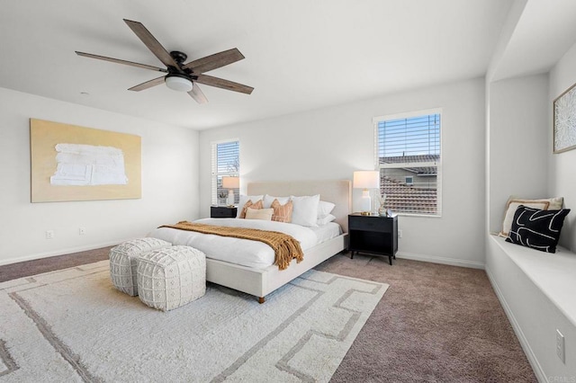 bedroom with carpet flooring, baseboards, and a ceiling fan