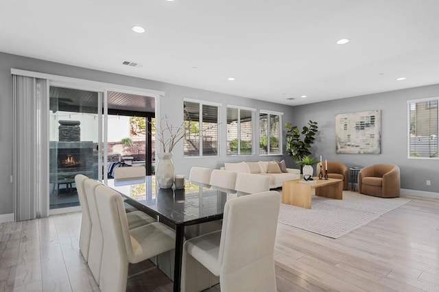 dining area featuring baseboards, recessed lighting, light wood finished floors, and visible vents