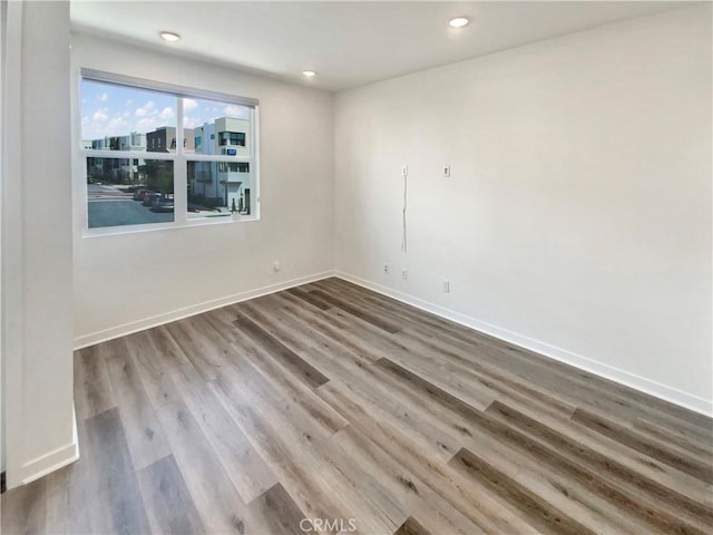 11032 Momentum Dr, Rancho Cucamonga, CA 91730 - empty room with baseboards, recessed lighting, and wood finished floors