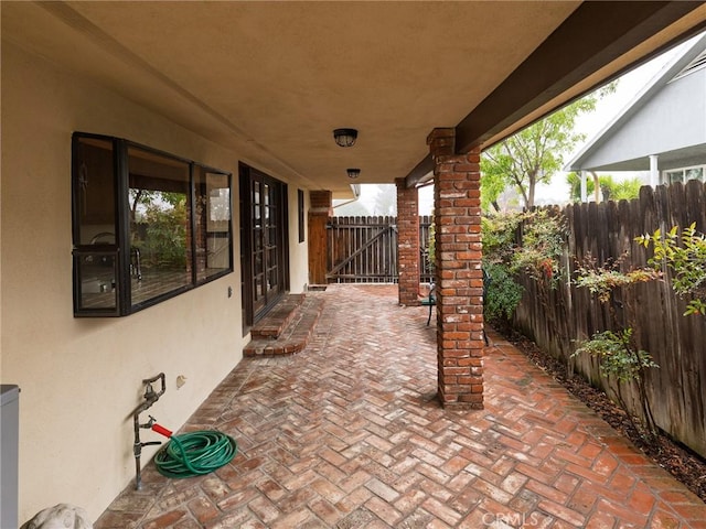 view of patio featuring fence