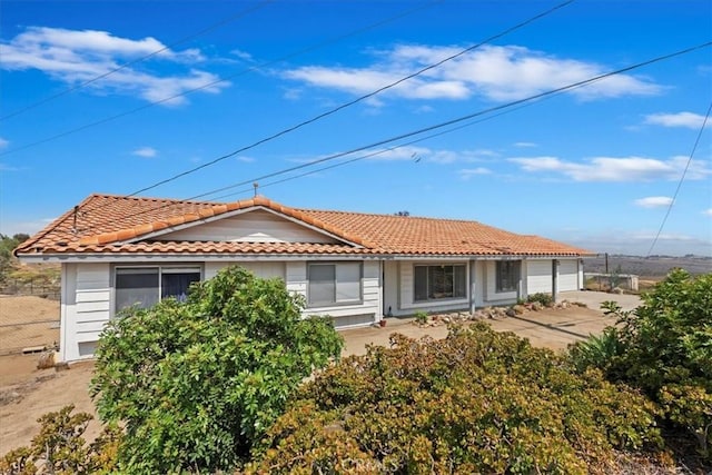 20061 Lounsberry Rd, Perris, CA 92570 - rear view of property with a tiled roof, concrete driveway, and a garage