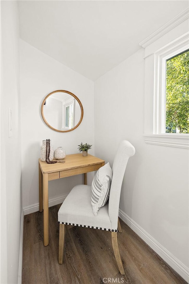 office space with baseboards and wood finished floors