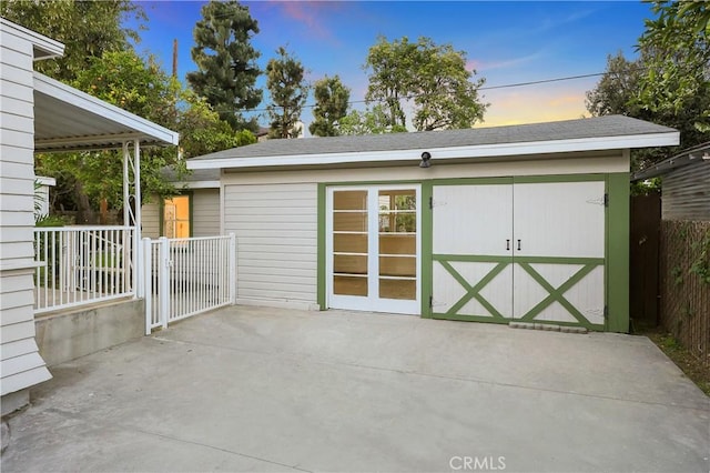 view of outbuilding with an outdoor structure and fence