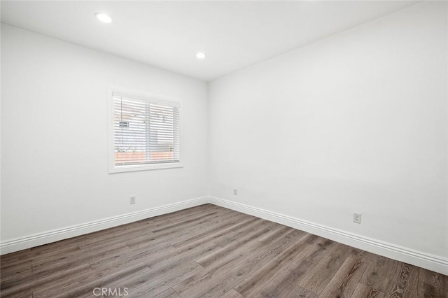 528 W 43rd St, Los Angeles, CA 90037 - empty room featuring wood finished floors and recessed lighting