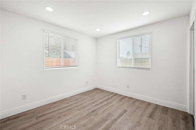 528 W 43rd St, Los Angeles, CA 90037 - spare room featuring wood finished floors and recessed lighting