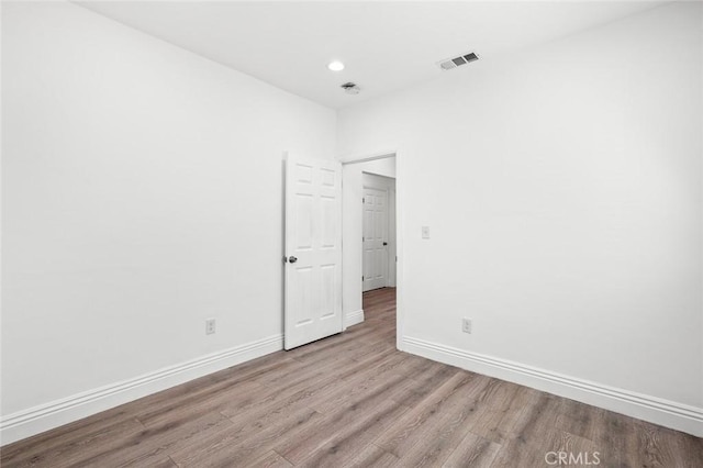 528 W 43rd St, Los Angeles, CA 90037 - empty room featuring wood finished floors and recessed lighting