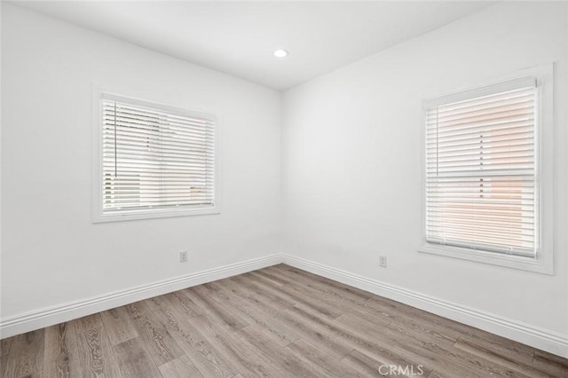 528 W 43rd St, Los Angeles, CA 90037 - empty room with wood finished floors and recessed lighting