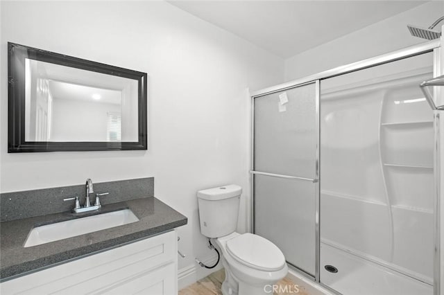 528 W 43rd St, Los Angeles, CA 90037 - full bathroom featuring a stall shower, vanity, and wood finished floors