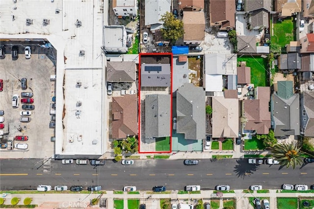 birds eye view of property with a residential view