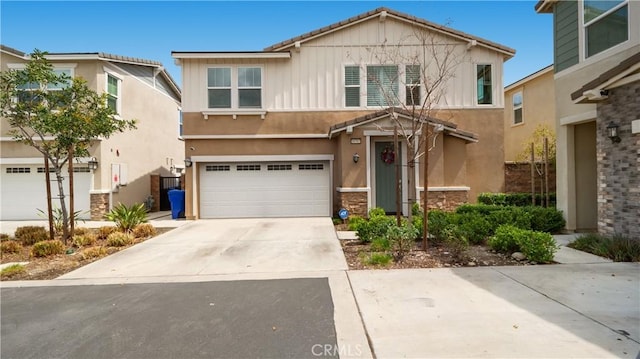 16763 Stags Leap Ln, Fontana, CA 92336 - traditional home with concrete driveway, a garage, stone siding, stucco siding, and board and batten siding