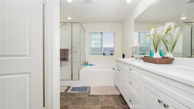 16763 Stags Leap Ln, Fontana, CA 92336 - bathroom with a stall shower, a garden tub, double vanity, and recessed lighting