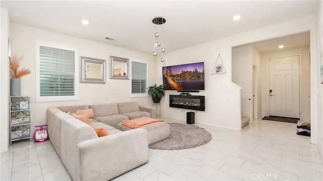 16763 Stags Leap Ln, Fontana, CA 92336 - living area featuring recessed lighting and marble look tiles
