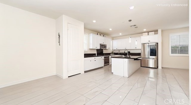16763 Stags Leap Ln, Fontana, CA 92336 - kitchen featuring stainless steel appliances, dark countertops, a center island with sink, white cabinets, and recessed lighting