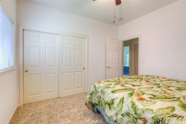 bedroom with carpet flooring, a closet, and ceiling fan