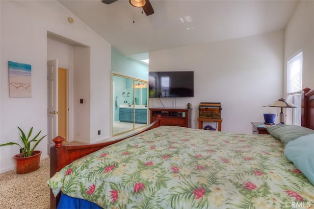 bedroom with carpet flooring, baseboards, lofted ceiling, a closet, and ceiling fan