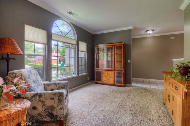 living area with light carpet, baseboards, visible vents, and a wealth of natural light