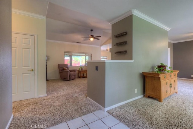 hall featuring ornamental molding, baseboards, and carpet