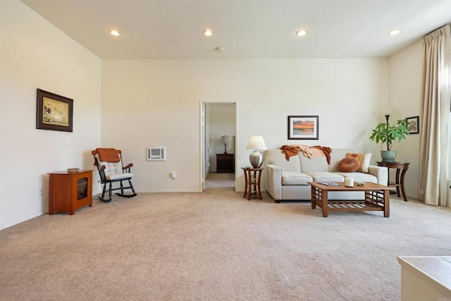living area with baseboards, light colored carpet, and recessed lighting