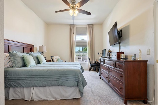 bedroom featuring a ceiling fan and light colored carpet