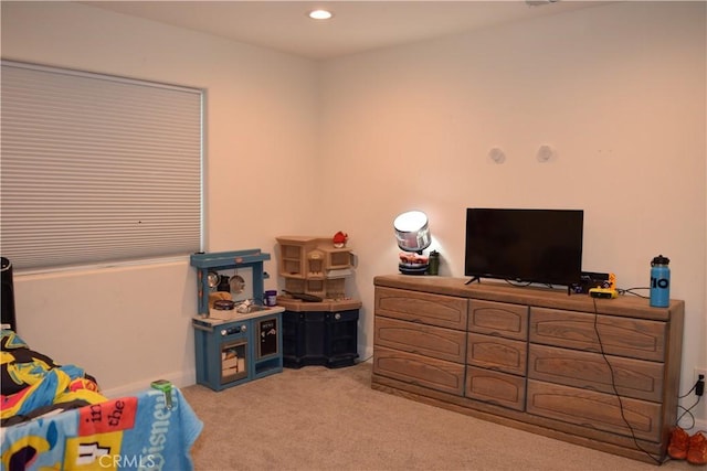bedroom with light carpet and recessed lighting