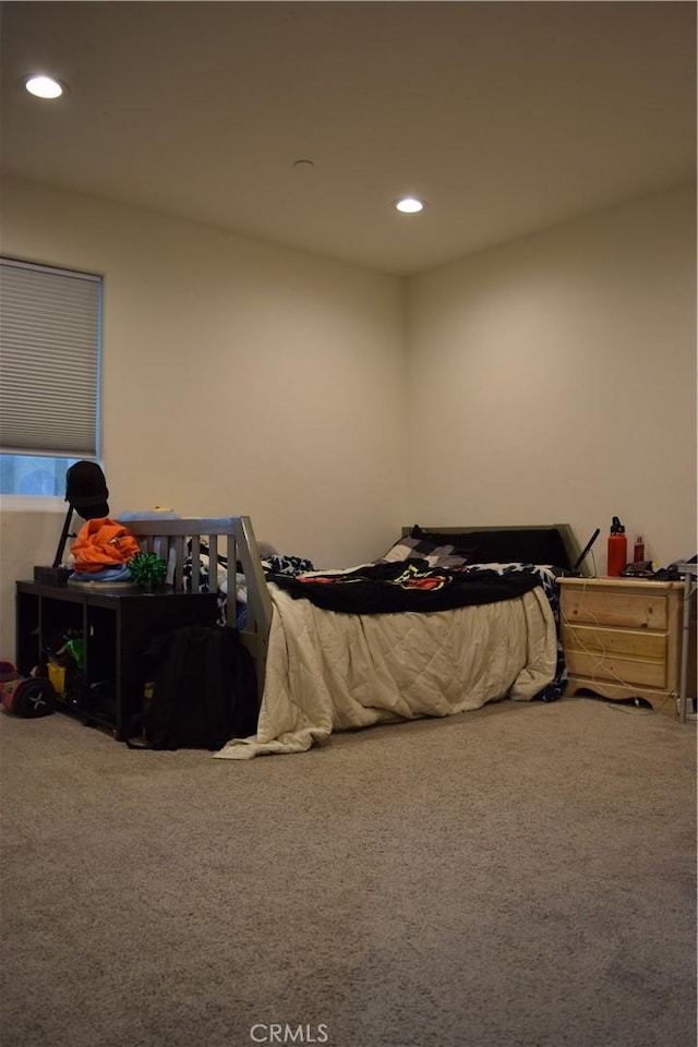 bedroom with recessed lighting and carpet