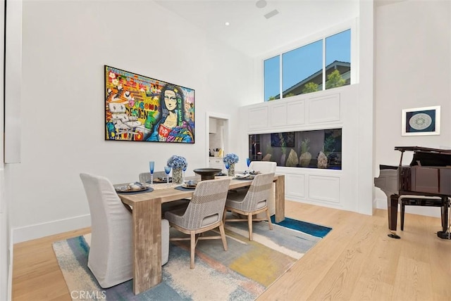 1954 Port Locksleigh Pl, Newport Beach, CA 92660 - home office featuring wood finished floors, a towering ceiling, and baseboards