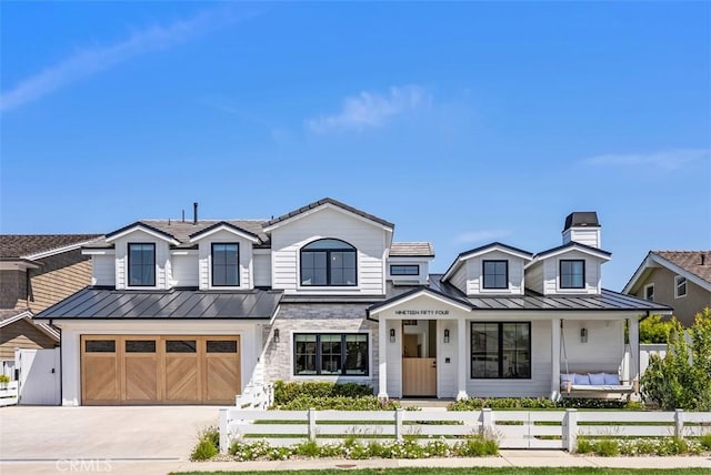 1954 Port Locksleigh Pl, Newport Beach, CA 92660 - view of front of property featuring a standing seam roof, a fenced front yard, an attached garage, and concrete driveway