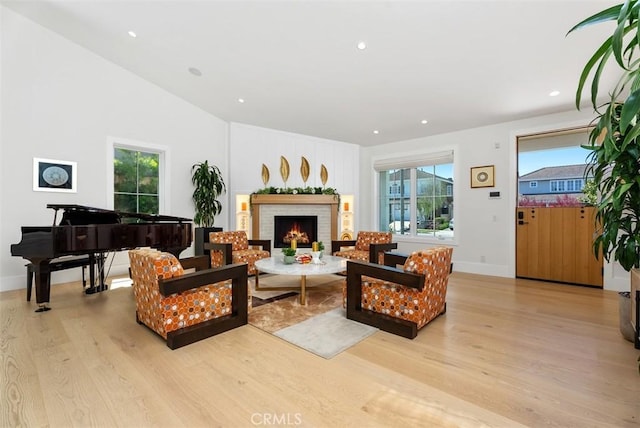 1954 Port Locksleigh Pl, Newport Beach, CA 92660 - living area with light wood finished floors, a fireplace, recessed lighting, baseboards, and vaulted ceiling