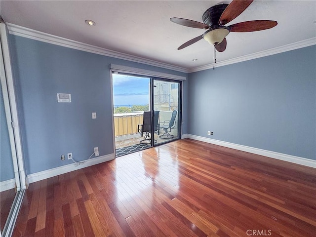 empty room with baseboards, a ceiling fan, and wood finished floors