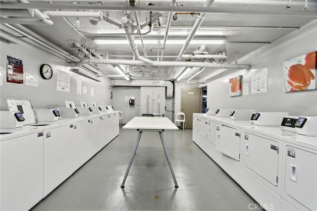 common laundry area with a garage and separate washer and dryer