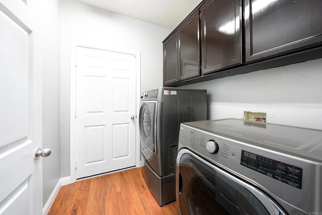 25318 Kerri Ln, Ramona, CA 92065 - laundry area featuring light wood-style flooring, cabinet space, baseboards, and separate washer and dryer
