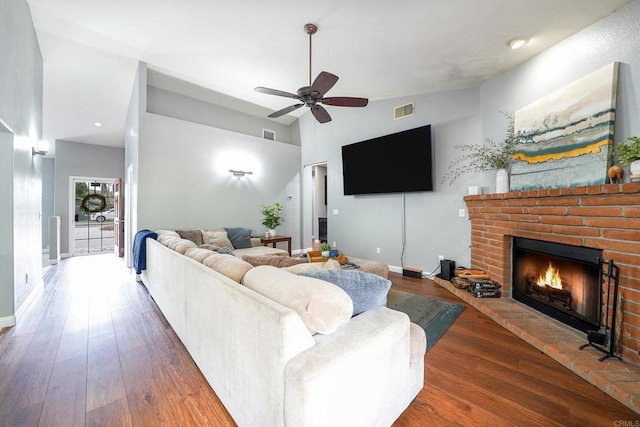 25318 Kerri Ln, Ramona, CA 92065 - living room featuring a ceiling fan, a fireplace, wood finished floors, lofted ceiling, and visible vents