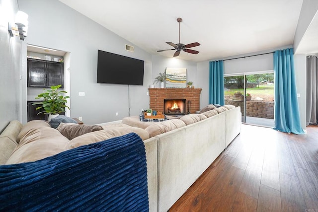 25318 Kerri Ln, Ramona, CA 92065 - living area with vaulted ceiling, hardwood / wood-style flooring, a brick fireplace, visible vents, and ceiling fan
