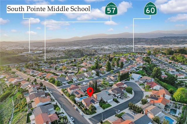 aerial view featuring a mountain view and a residential view
