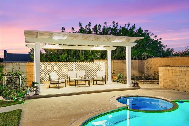pool at dusk featuring fence, a patio, an outdoor living space, a fenced in pool, and a pergola