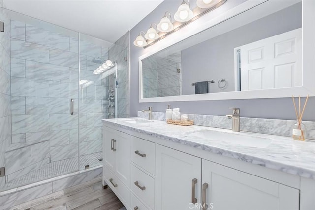 23163 Mulholland Dr Unit 6, Woodland Hills, CA 91364 - bathroom featuring double vanity and a shower stall