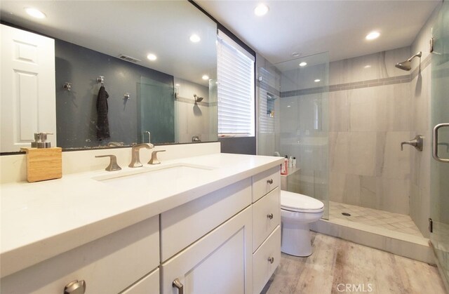 2512 Santa Ana Ave Unit 9, Costa Mesa, CA 92627 - full bathroom with a stall shower, toilet, vanity, wood finished floors, and recessed lighting