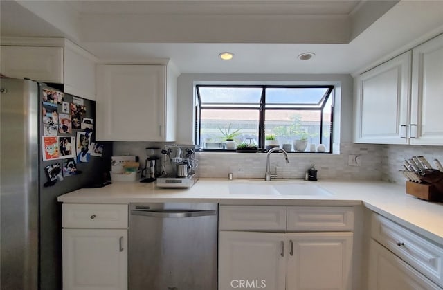 2512 Santa Ana Ave Unit 9, Costa Mesa, CA 92627 - kitchen featuring appliances with stainless steel finishes, a sink, white cabinets, recessed lighting, and tasteful backsplash